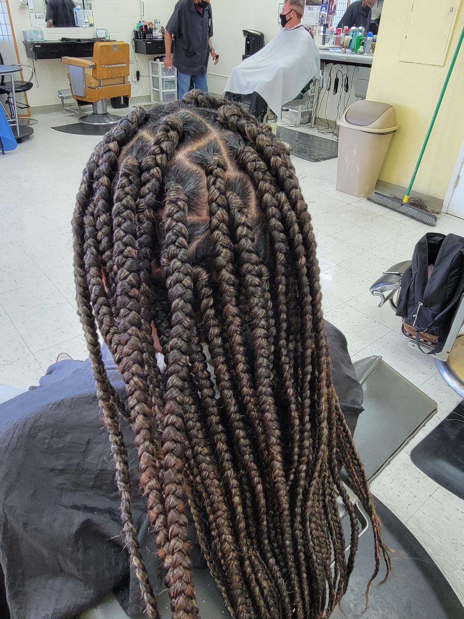 Thick braids, crown detail in the actual shop; distinct from the prior long small-braid result